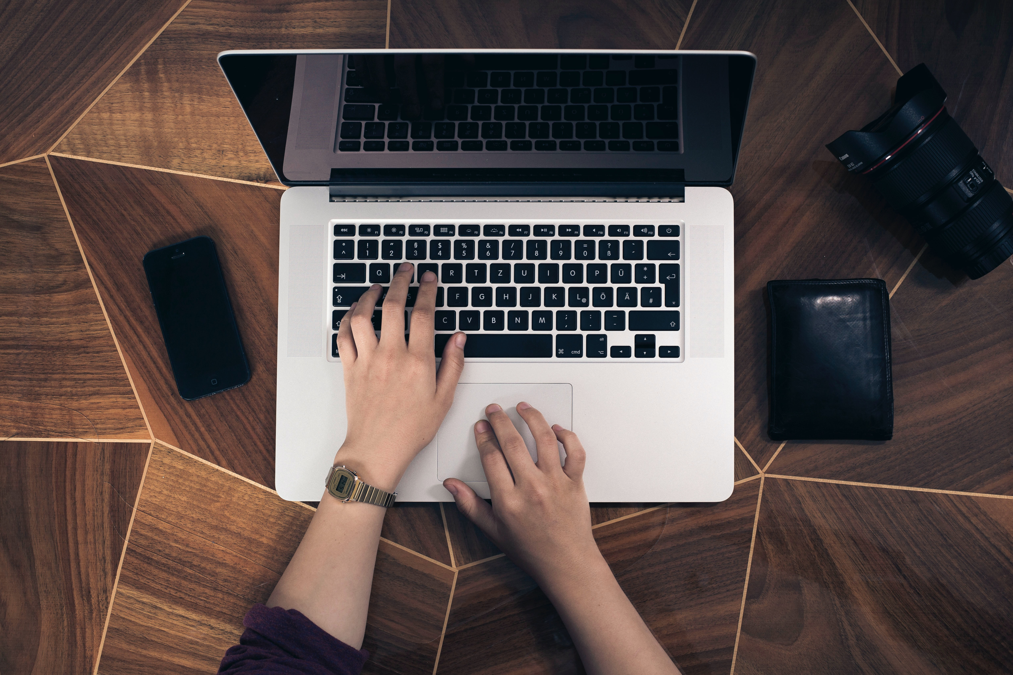 A person using a laptop to craft shareable content
